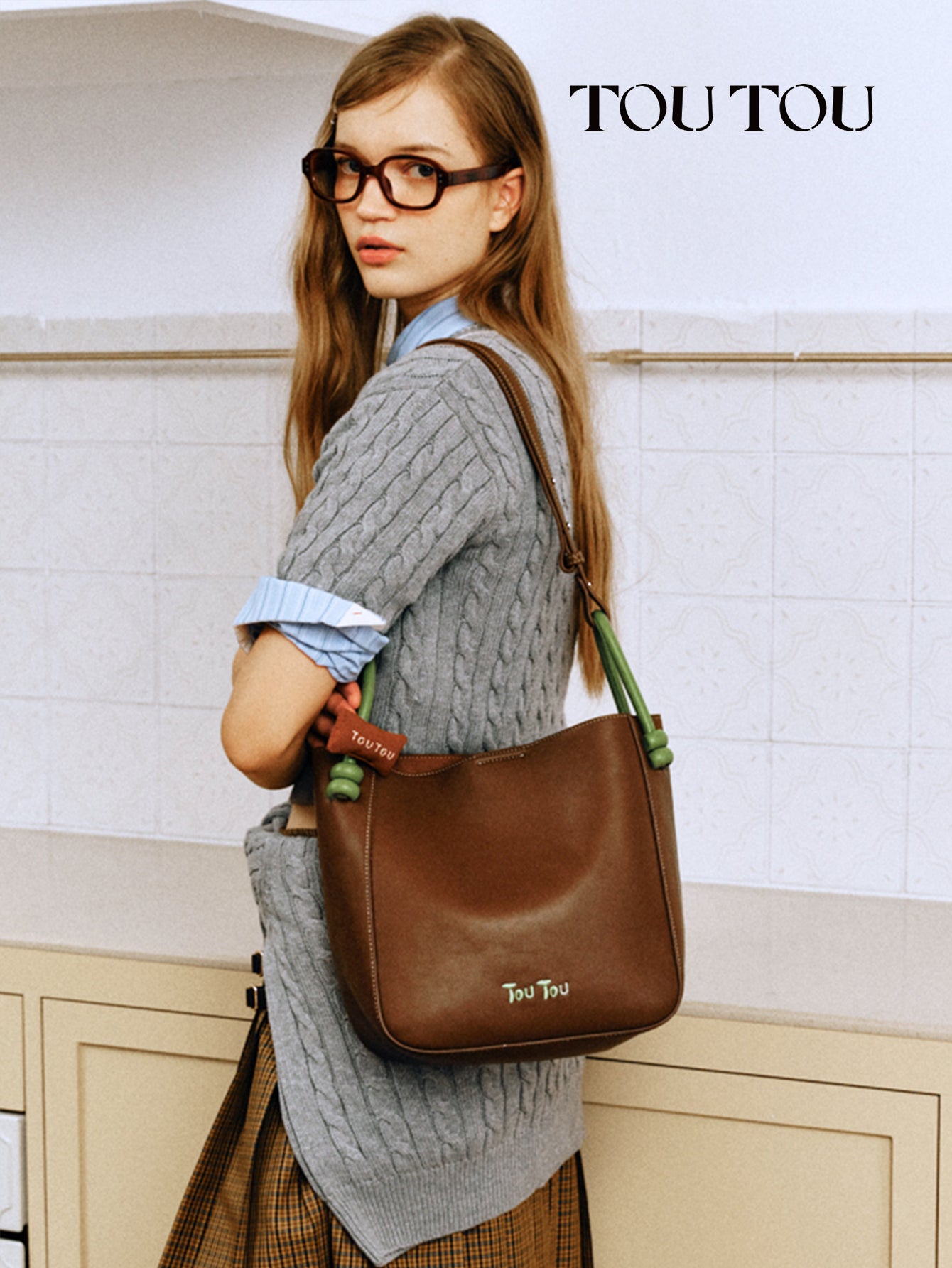 TOUTOU Brown Bucket Bag: Contrast - Color Handles & Versatile Carry