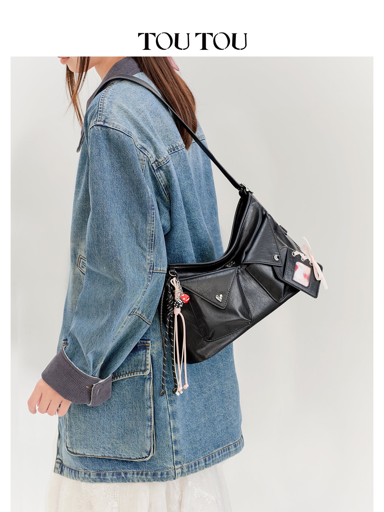 TOUTOU Black Crossbody Bag: Edgy Design with Adjustable Strap