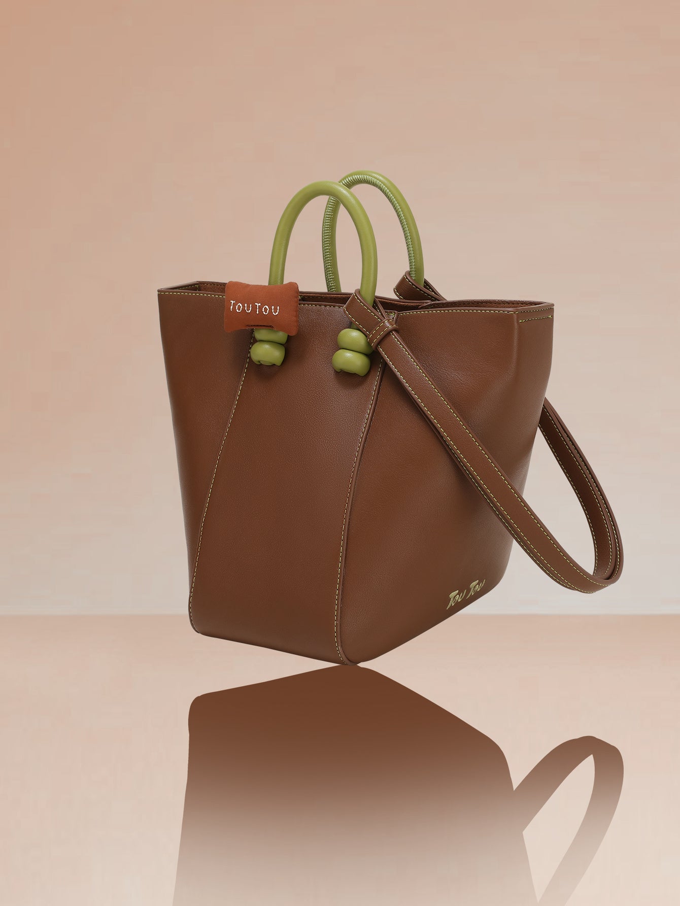 TOUTOU Brown Bucket Bag: Contrast - Color Handles & Versatile Carry