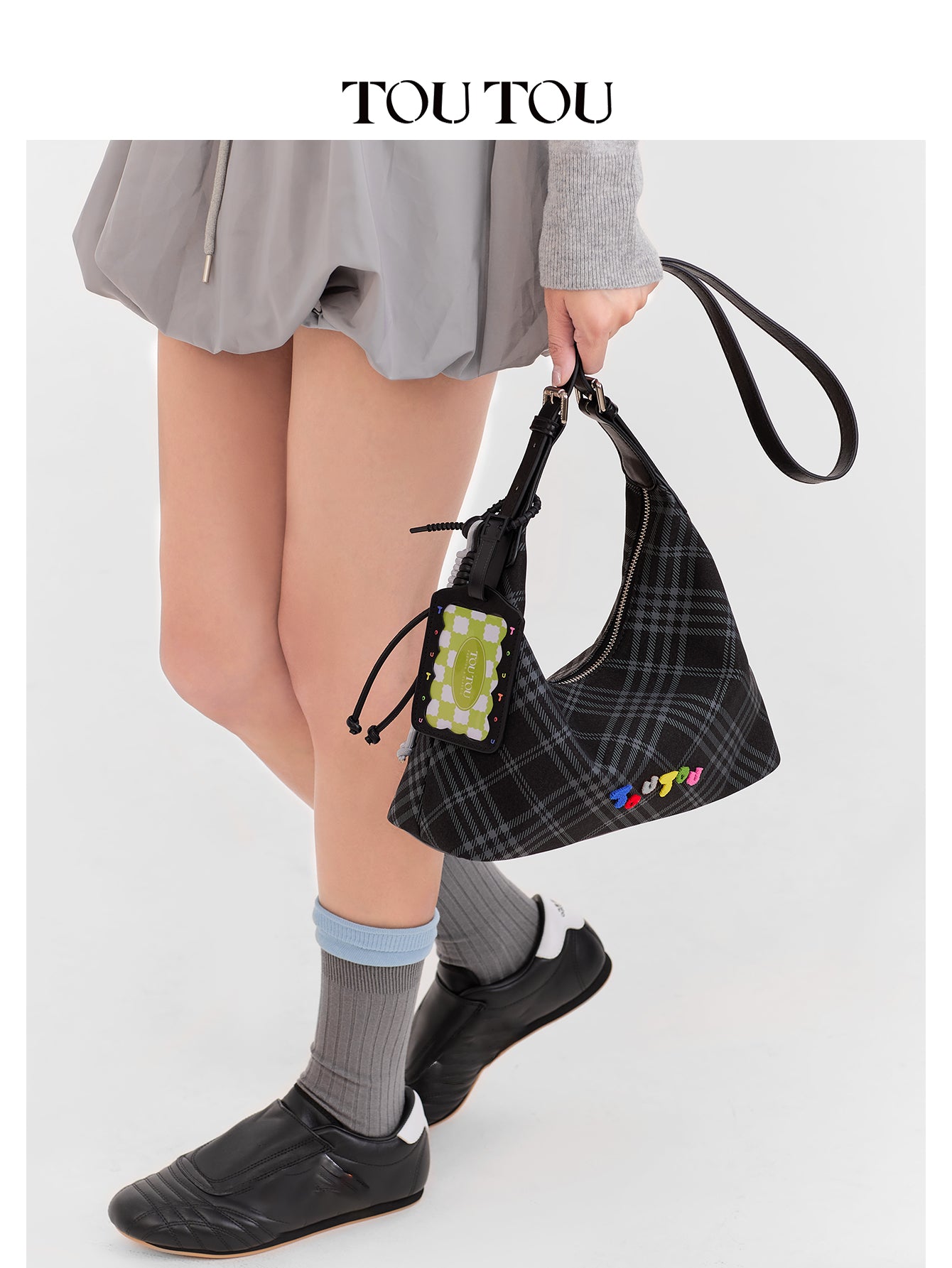 TOUTOU Black Plaid Hobo Bag with Colorful Branding: Trendy & Playful